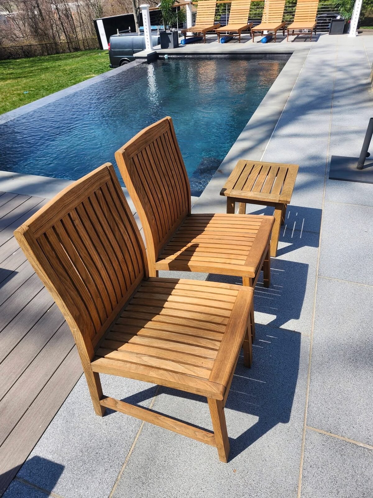 Restored and refinished teak poolside chairs and side table