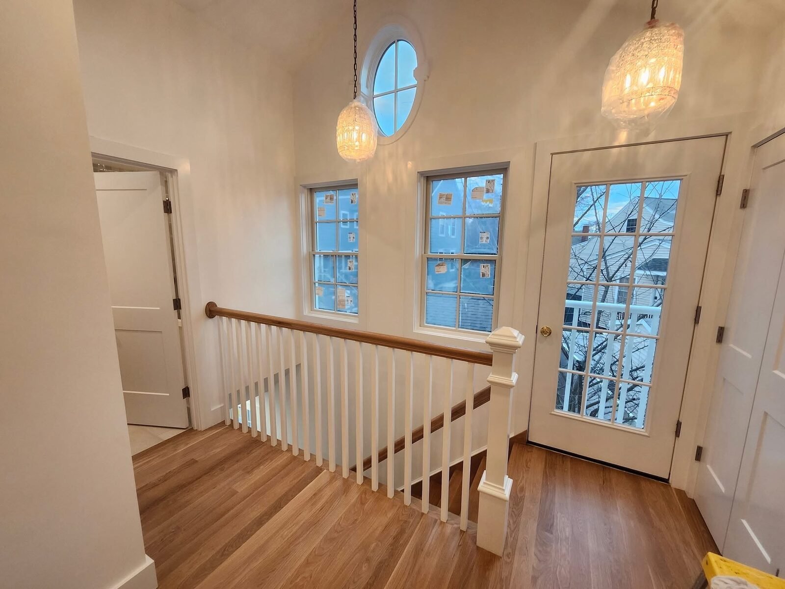 Bright white upstairs landing with freshly painted walls and trim in a Darien CT home