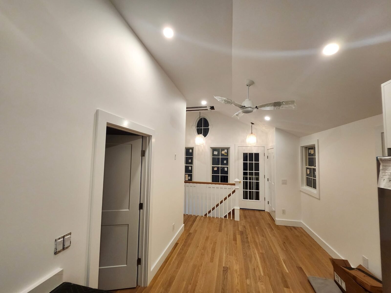 Freshly painted vaulted loft landing with white walls in a Norwalk CT home